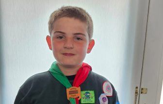 Boy, ten, celebrates achieving all 57 Cubs badges