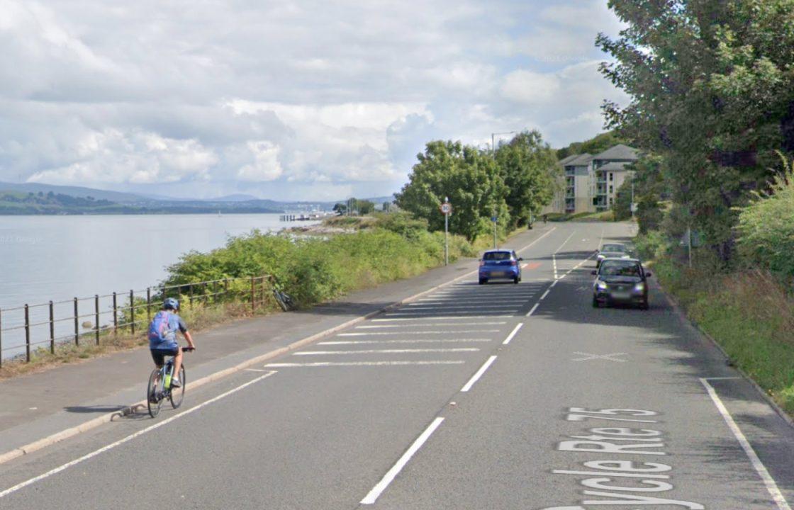 Man rescued by firefighters after car leaves road and crashes onto beachfront in Gourock