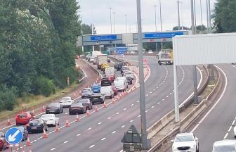 Two police among four in hospital after multi-car crash closes M8 in Glasgow