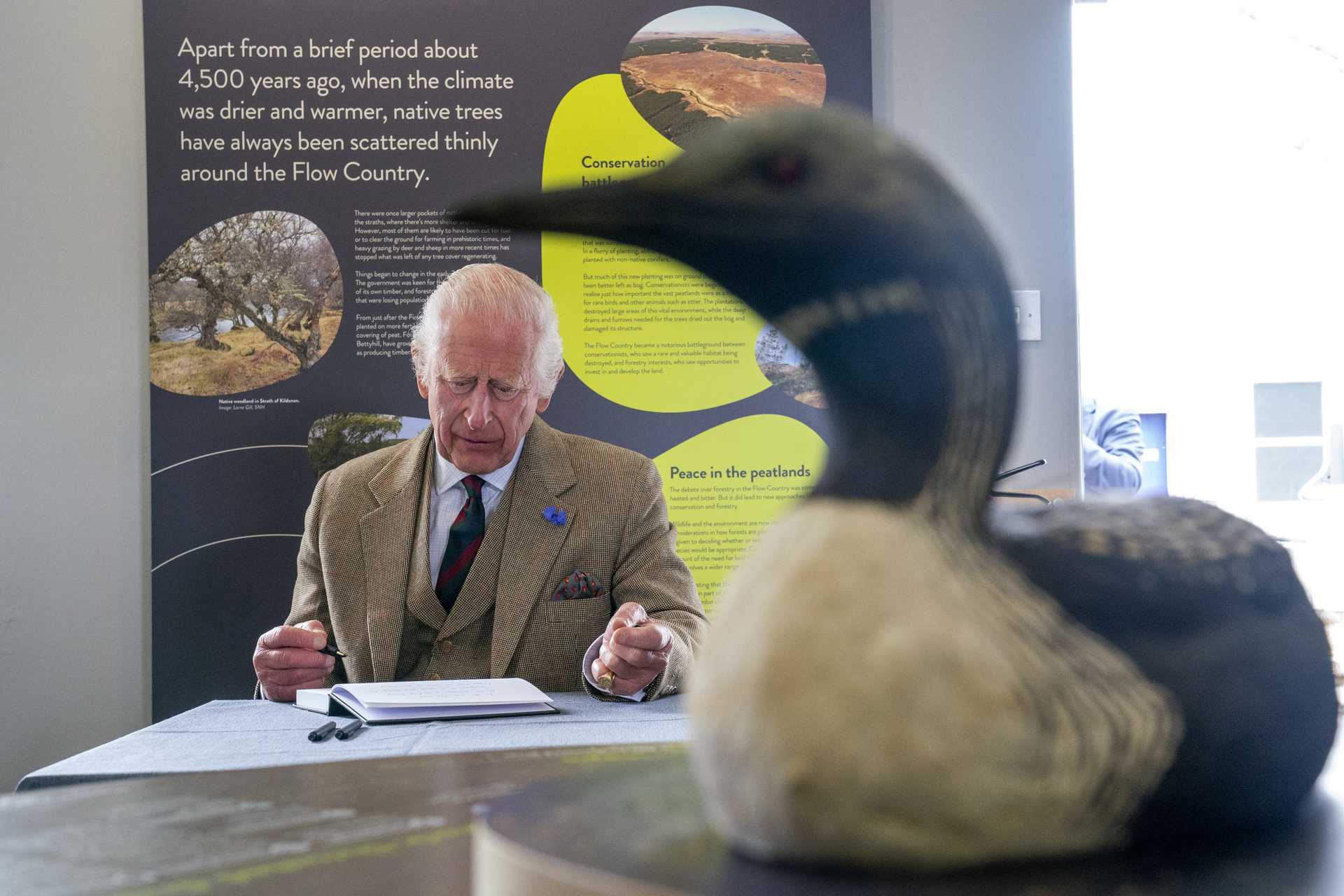 Charles signed the visitor book at Forsinard Flows Visitor Centre (Jane Barlow/PA) 