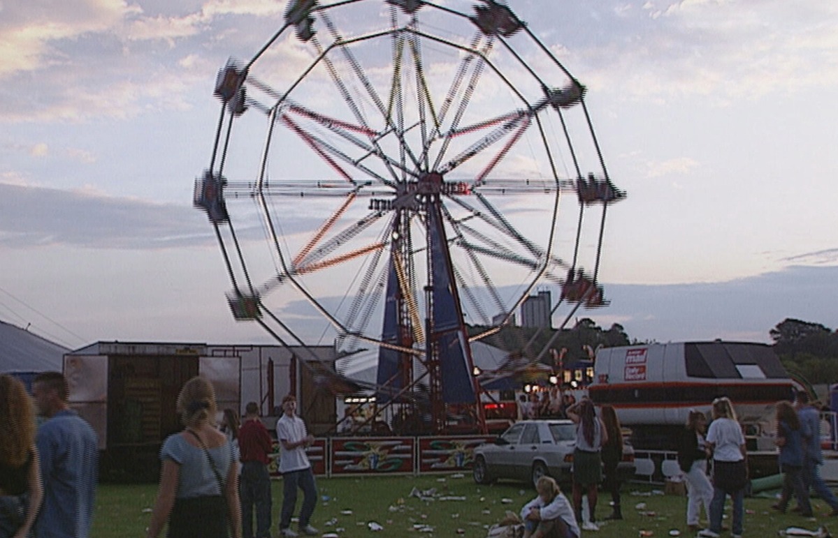 Fans wander around the 1994 campsite. 