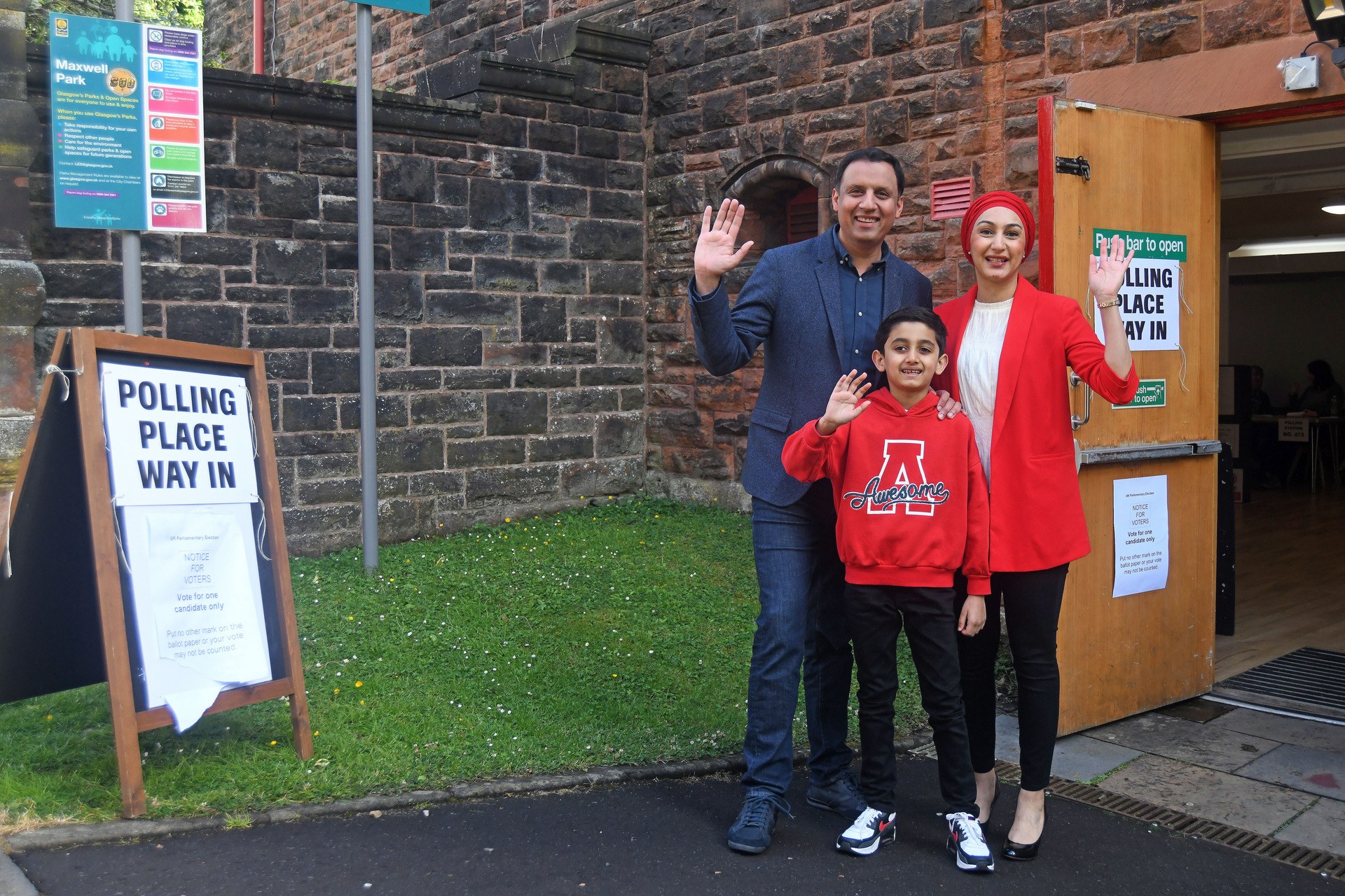 Leader of the Scottish Labour Party, Anas Sarwar, arrives with his family to vote at a polling station at Pollokshields Burgh Hall.