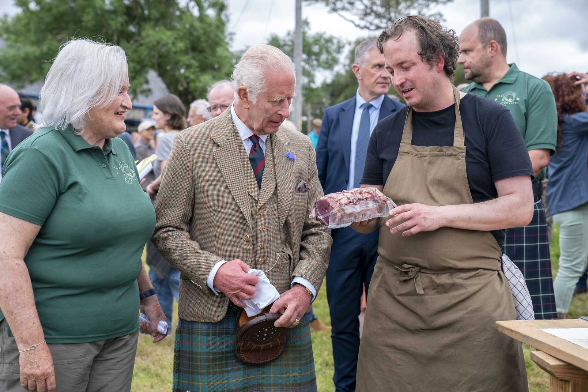 Charles was presented with a saddle of venison to take home (Jane Barlow/PA) 