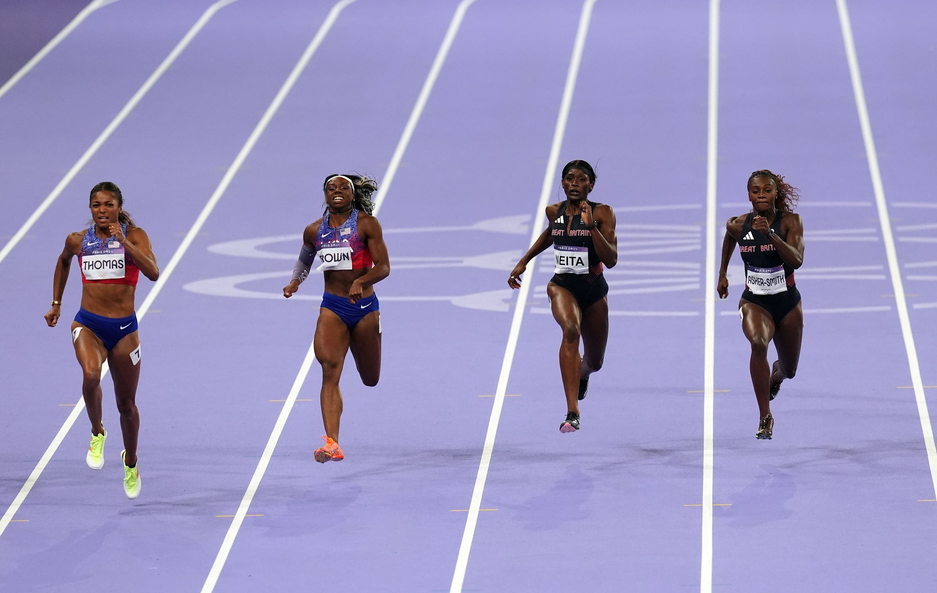 Great Britain’s Dina Asher-Smith, right, and Daryll Neita, second right, finish fourth and fifth in the women’s Olympic 200m final.