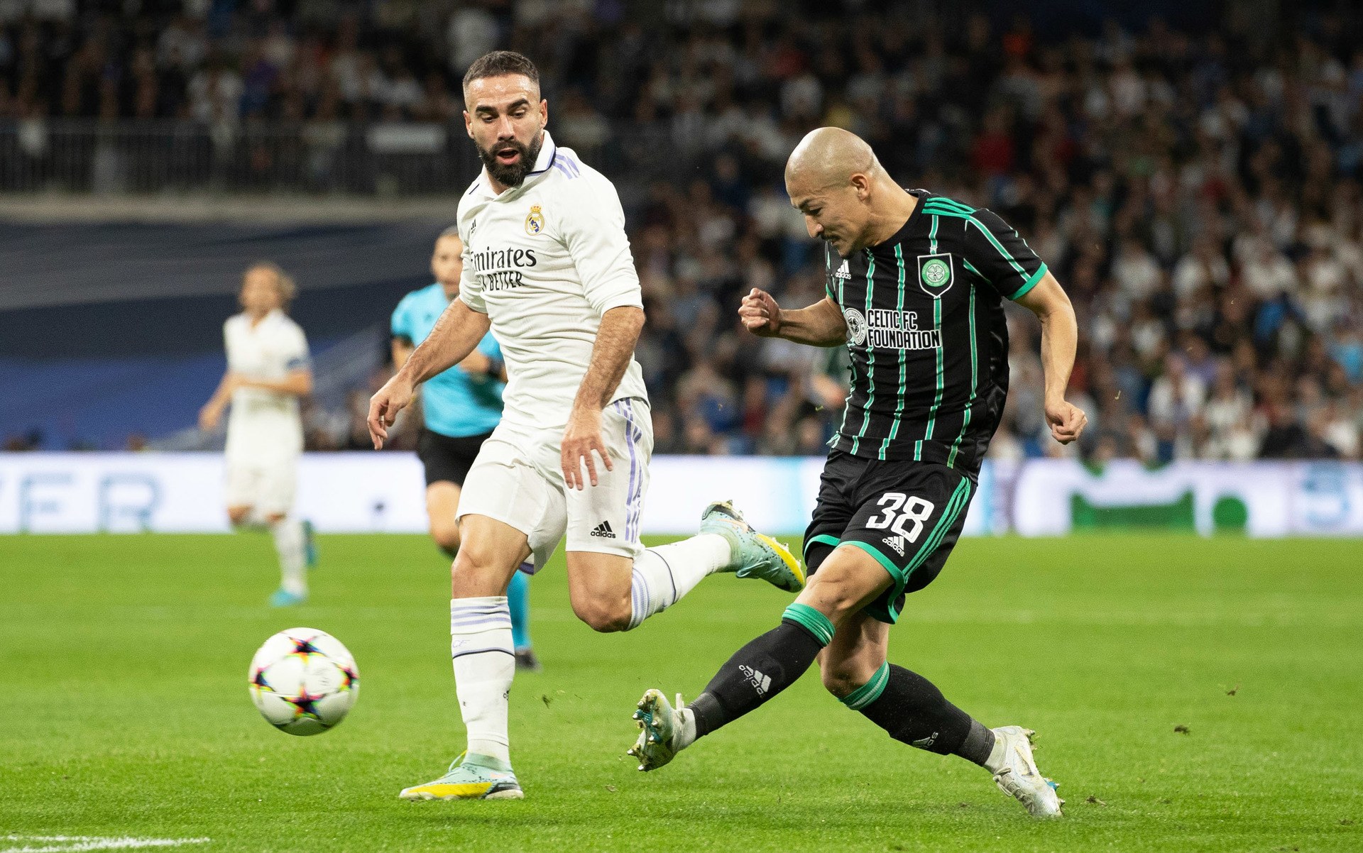 Daizen Maeda and Dani Carvajal in action during a UEFA Champions League match between Real Madrid and Celtic at the Santiago Bernabeu, on November 2, 2022.