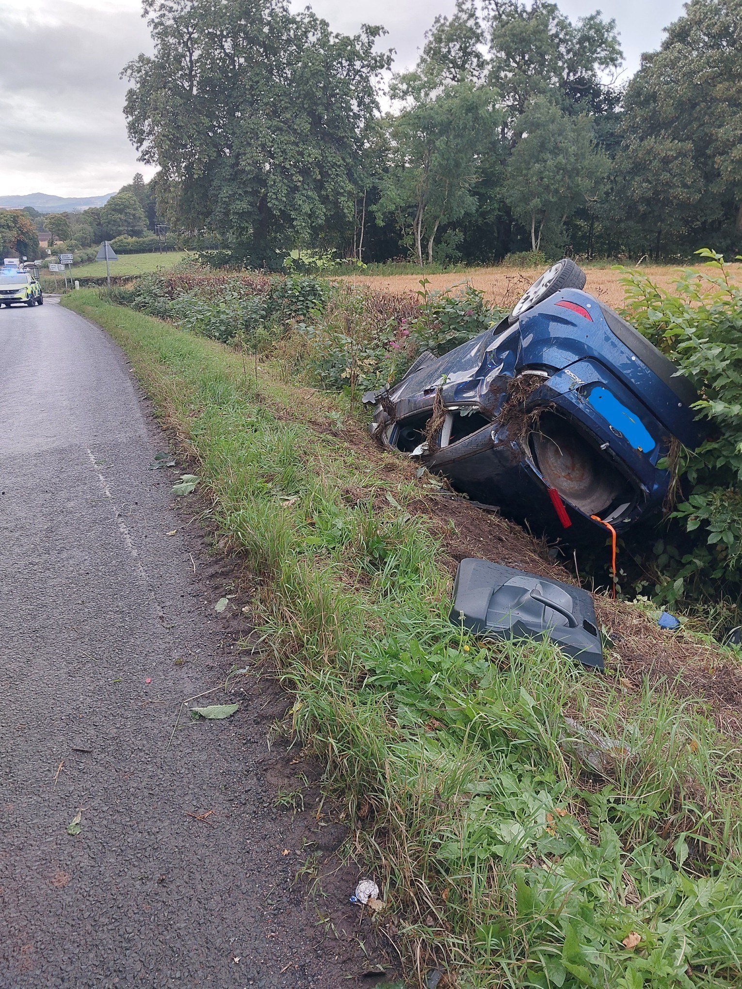 Emergency services were called to the A923 between Dundee and Dunkeld on Sunday after the vehicle left the road.