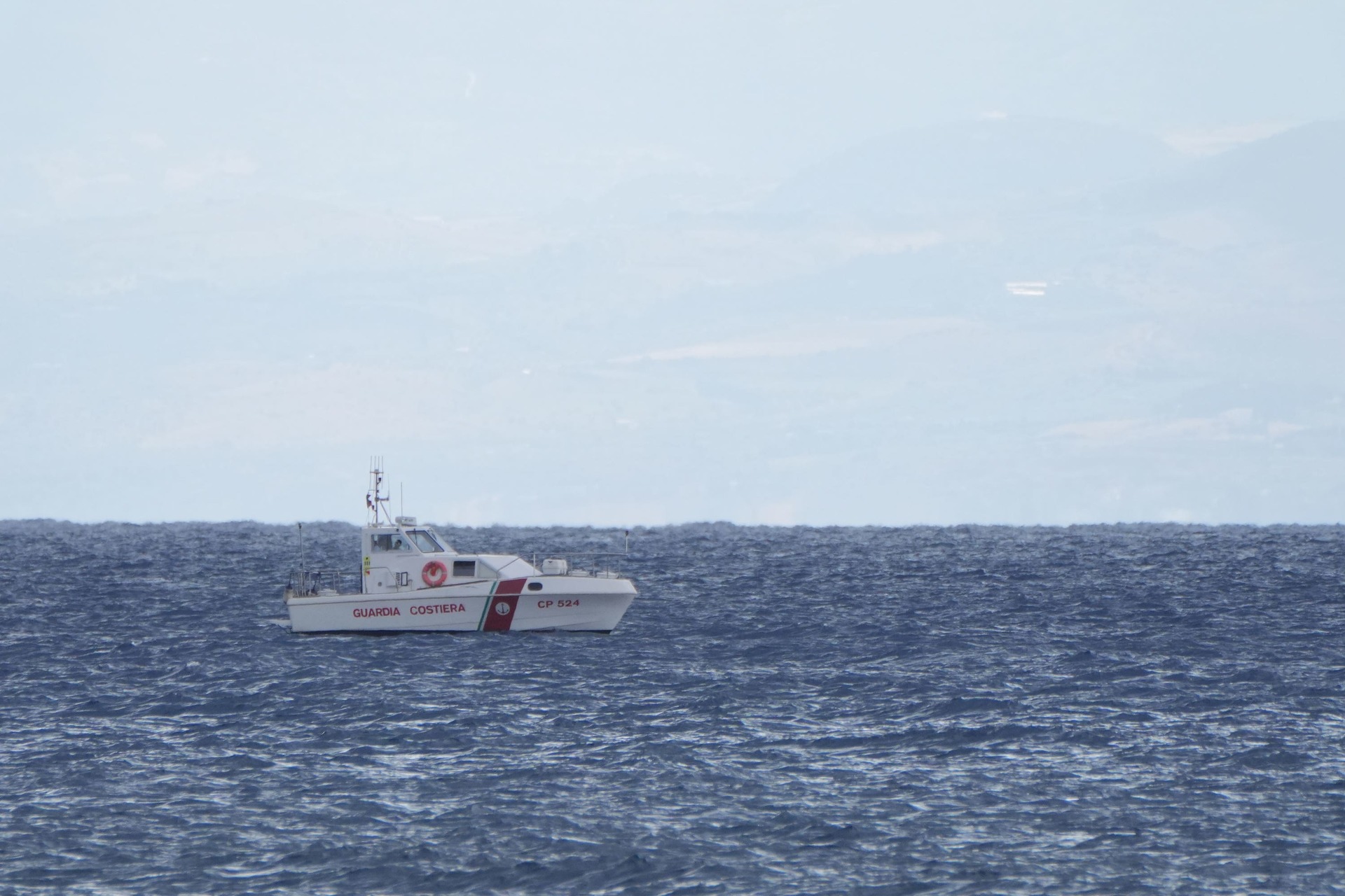 Italian emergency services heading towards the area off the Sicilian coast where a luxury yacht sank in a tornado.