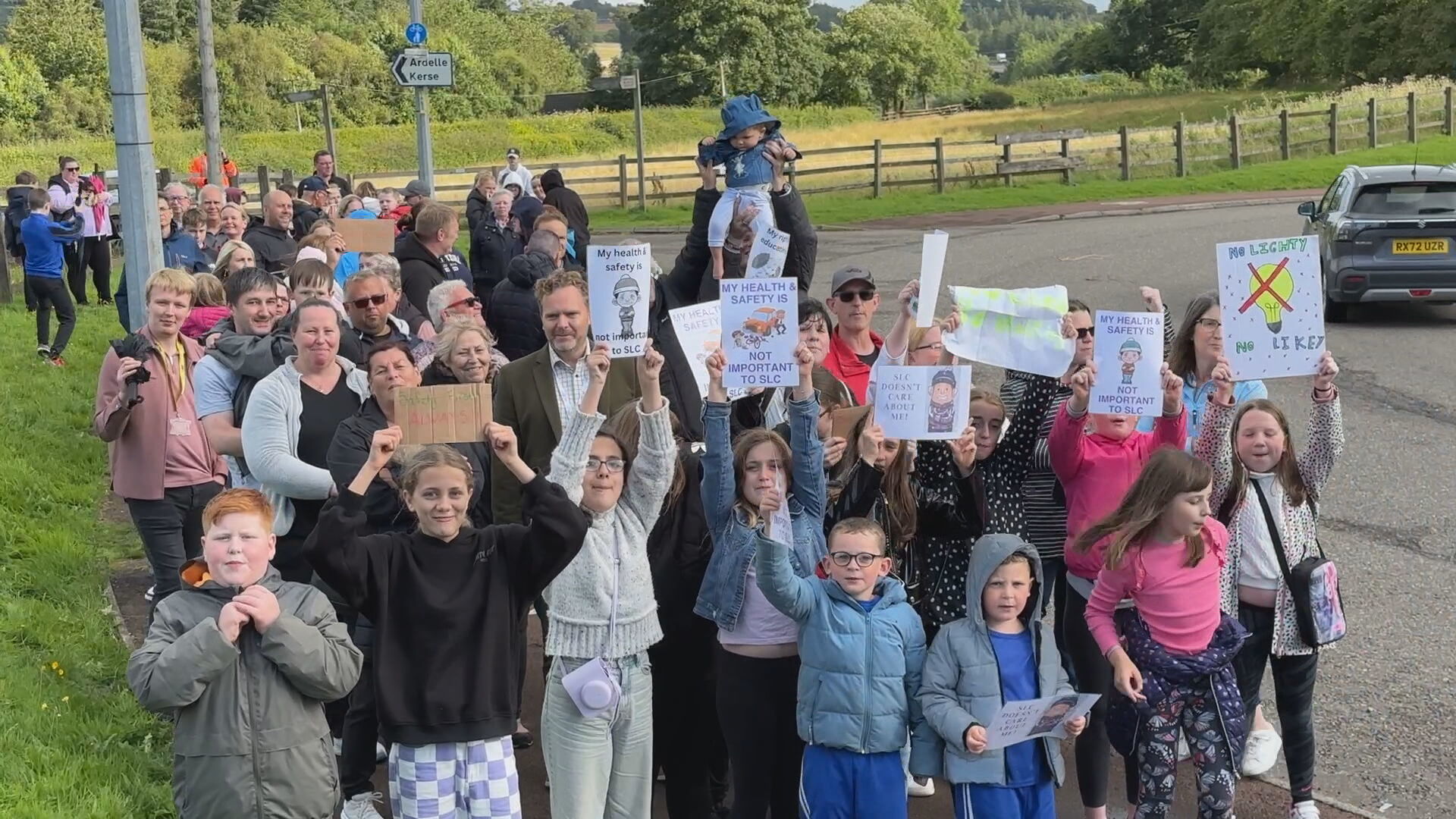 Families protest at 'dangerous' route as children forced to walk three miles to school