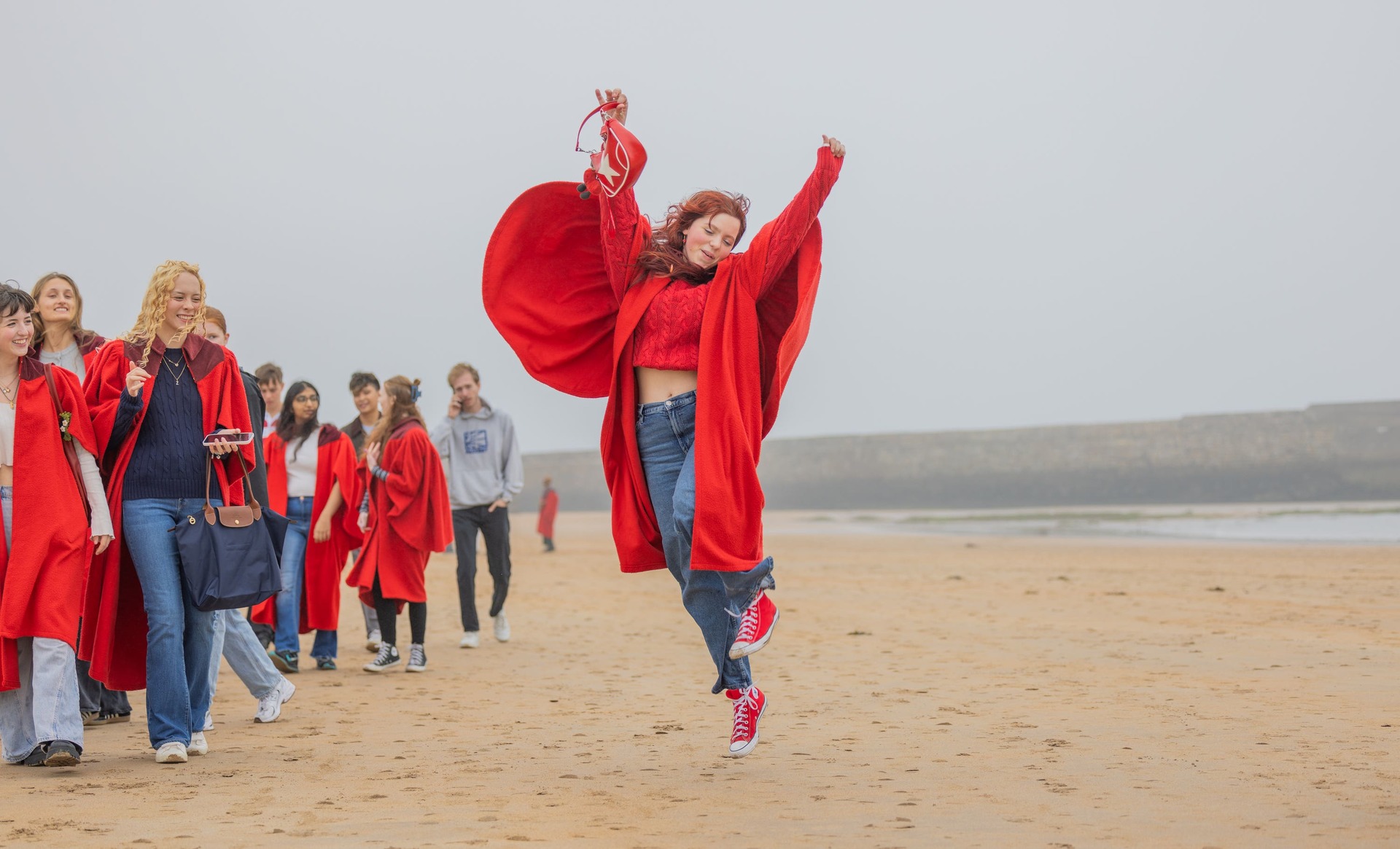 Students celebrate the start of the new term on East Sands (University of St Andrews/PA). 