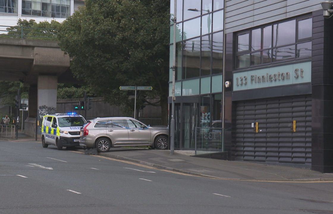 Woman taken to hospital after car crashes into Finnieston office building in Glasgow