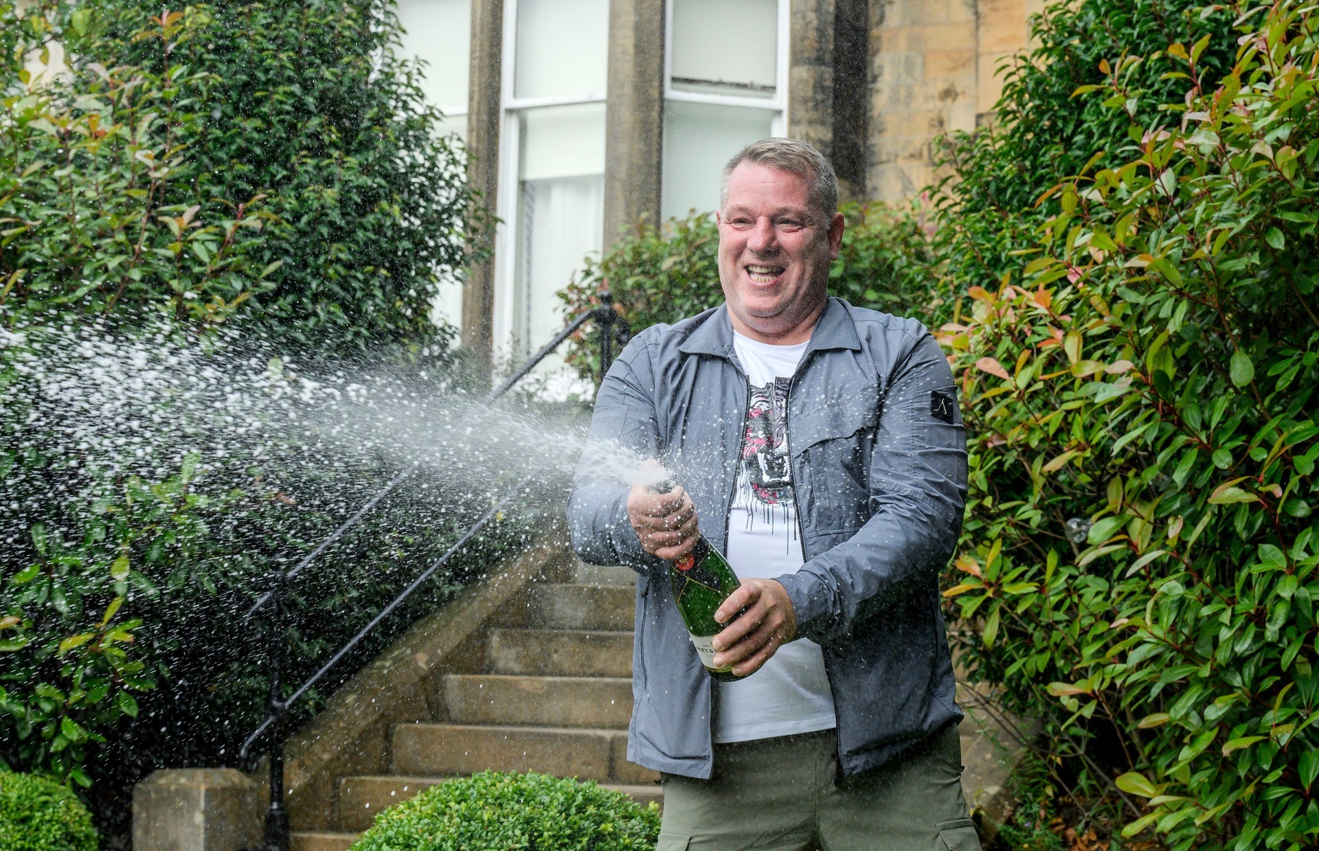 John McDowell celebrates his National Lottery win (Alan Peebles/PA Wire) 