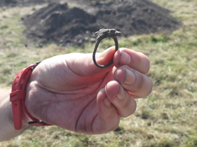 A shot of the Pictish ring shortly after it was excavated. (University of Aberdeen/PA). 