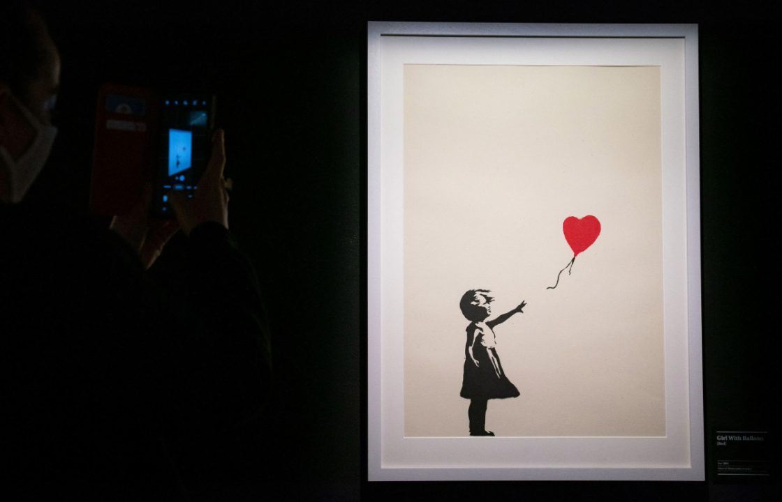 Two charged with burglary after Banksy painting stolen from London gallery