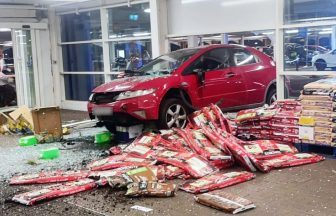 Man charged after car crashes through Tesco supermarket in Greenock