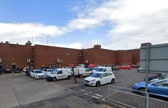 Man taken to hospital after falling from roof of building in Kilmarnock