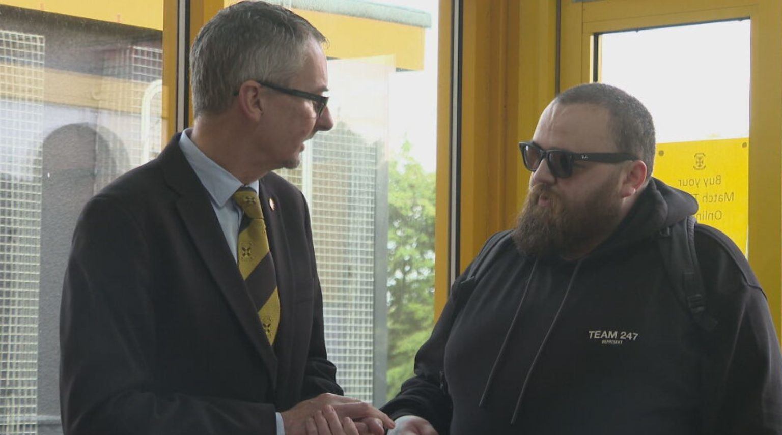 Disability officer Stephen Mill meets Jon Attenborough at East Fife stadium.