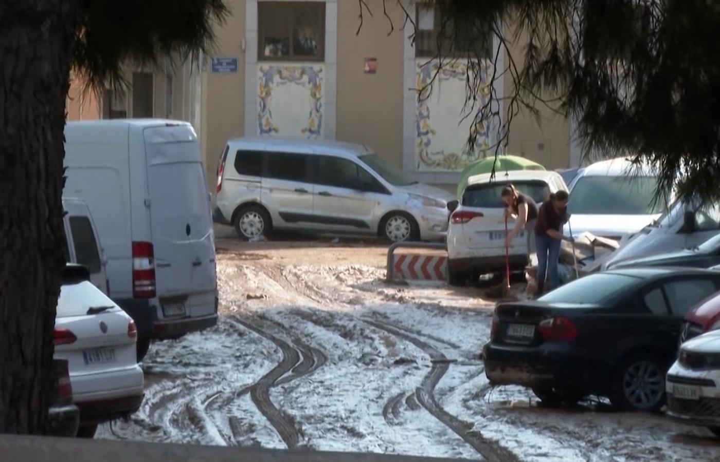 Footage from Valencia showed mud-coloured waters tearing through streets, with cars swept away and rail services disrupted.