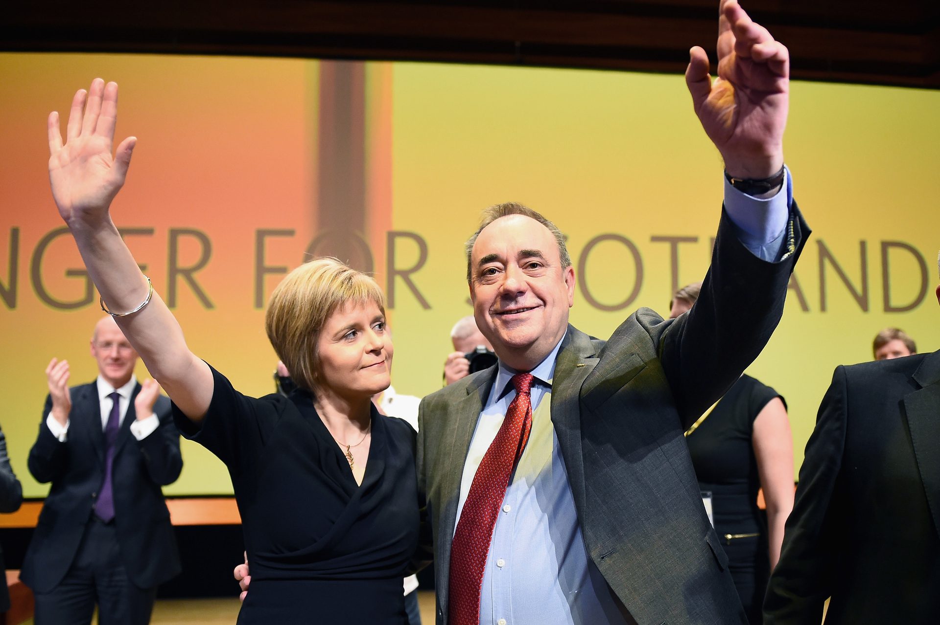 First Minister of Scotland Alex Salmond, acknowledges applause with Nicola Sturgeon following his last key note speech as party leader of the SNP