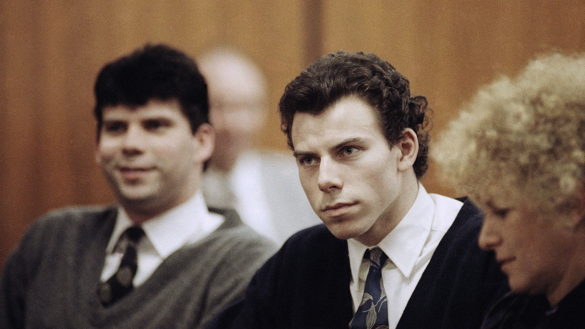 Lyle, left, and Erik Menendez sit with defense attorney Leslie Abramson, right, during their trial in 1990. 