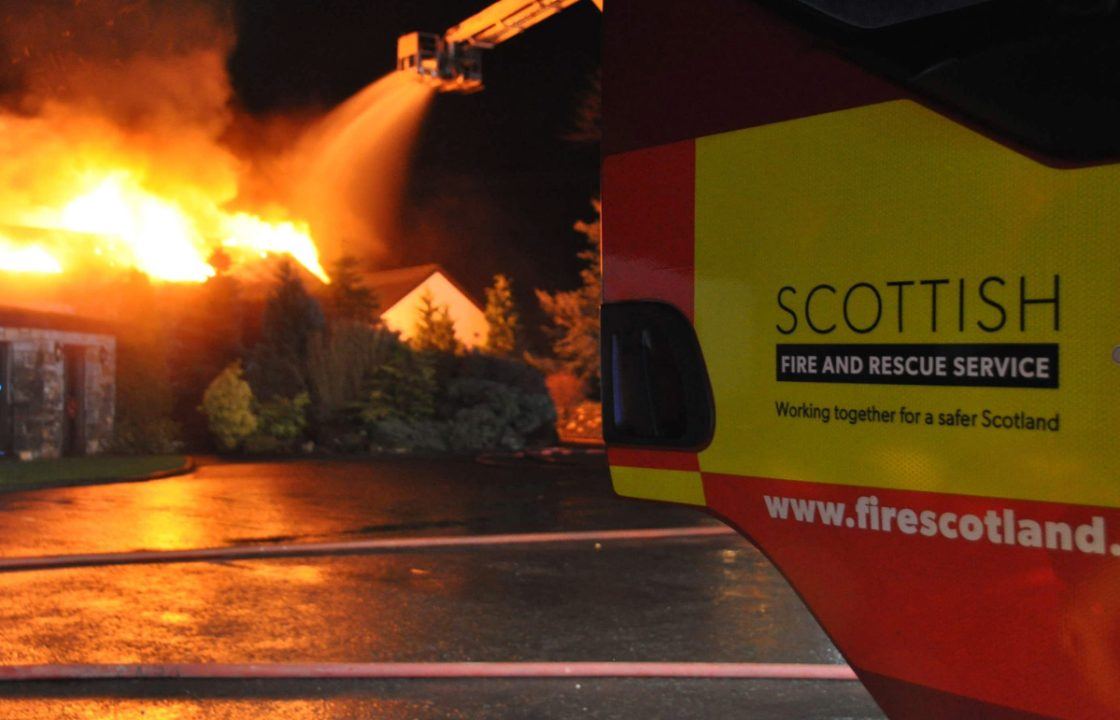 Emergency services tackle fire at block of flats in Glasgow