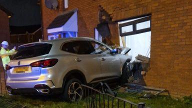 Family in narrow escape after car ploughs into their living room in Glasgow