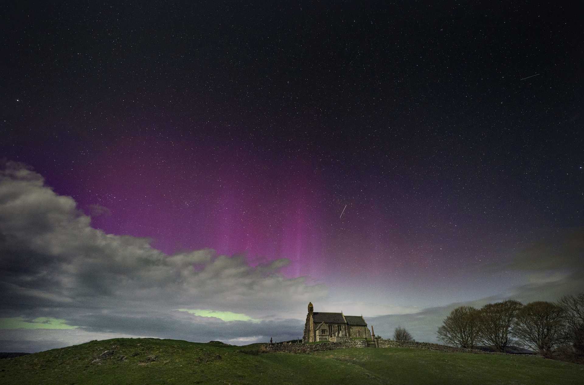 The Northern Lights illuminate the sky in Northumberland (Owen Humphreys/PA) 