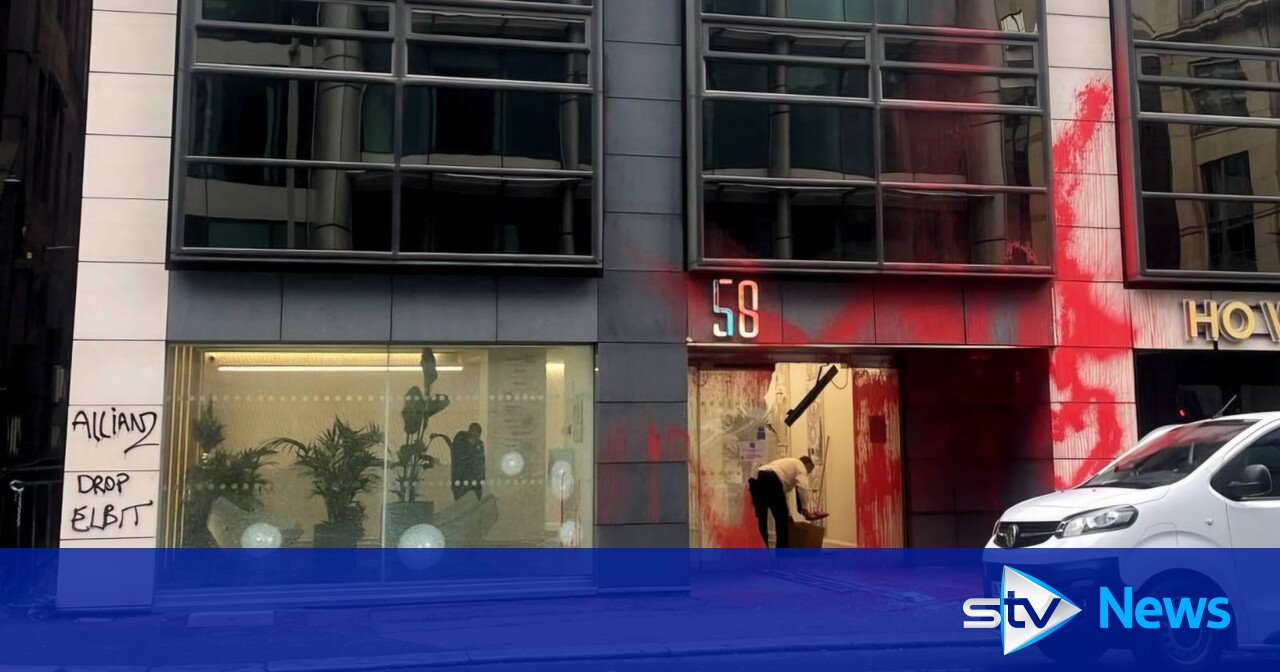 Protesters throw red paint and smash windows at Allianz office block in ...