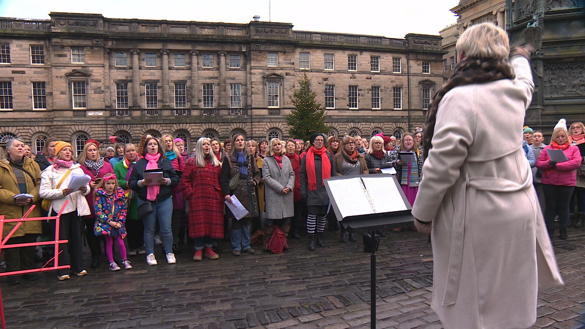 A choir perform at Janey Godley's 'final tour.