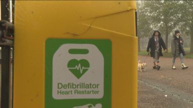 Two runners call for more defibrillators after being saved by the same device