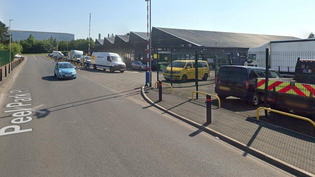 Man taken to hospital after car crashes into building in East Kilbride