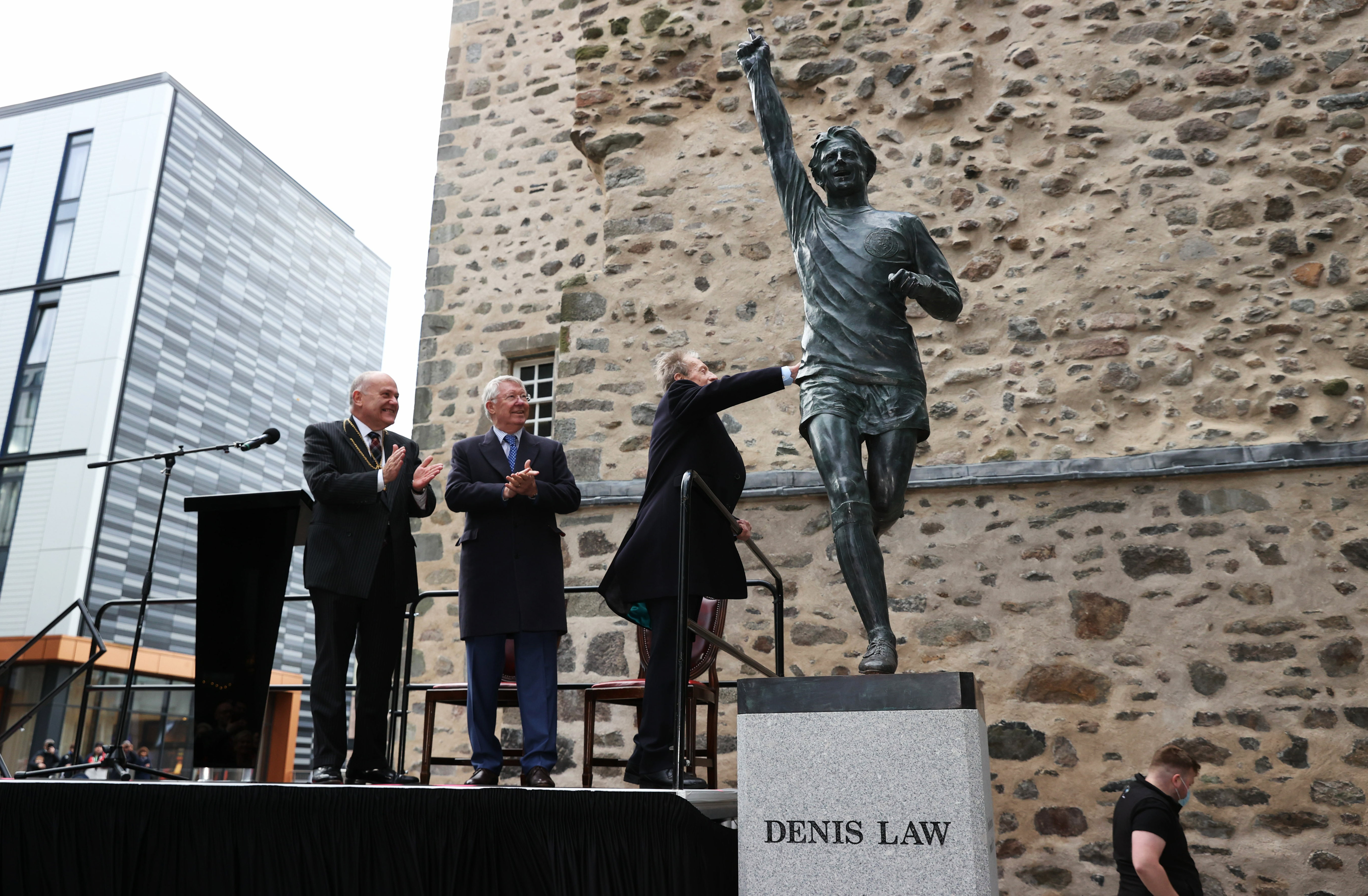 A statue of Scotland and Manchester United legend Denis Law is unveiled outside Provost Skenes House, on November 18, 2021, in Aberdeen.