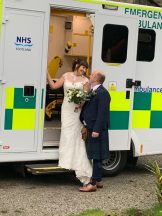 Paramedics celebrate wedding day with ambulance backdrop after meeting on the job