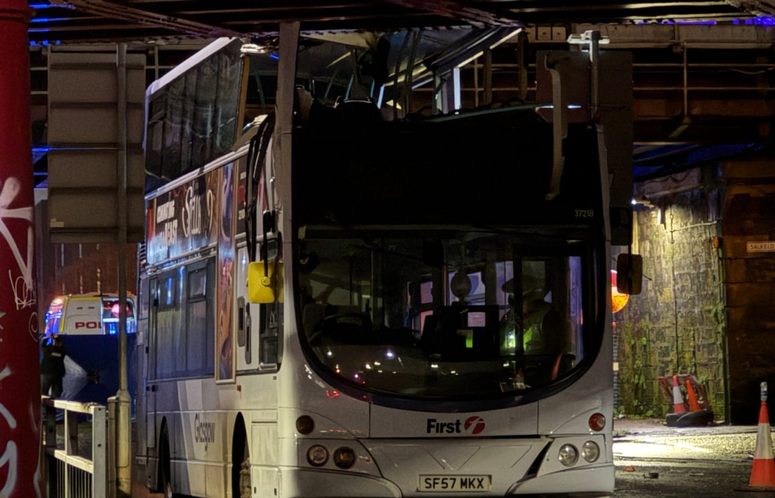 Person fighting for life among eight injured after double-decker bus crashes into bridge in Glasgow