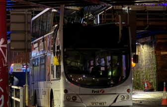 Passenger in hospital after double-decker bus crashes into bridge in Glasgow