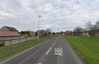 Three people taken to hospital after van and car catch fire following crash in Grangemouth