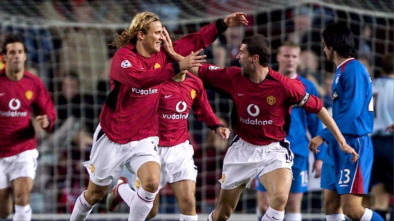 Diego Forlan and Roy Keane celebrate the Uruguayan's strike in 3-0 win. 