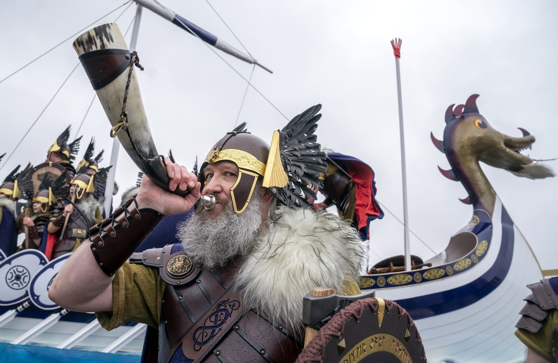 Members of the Jarl Squad parade through Lerwick (Jane Barlow/PA) 