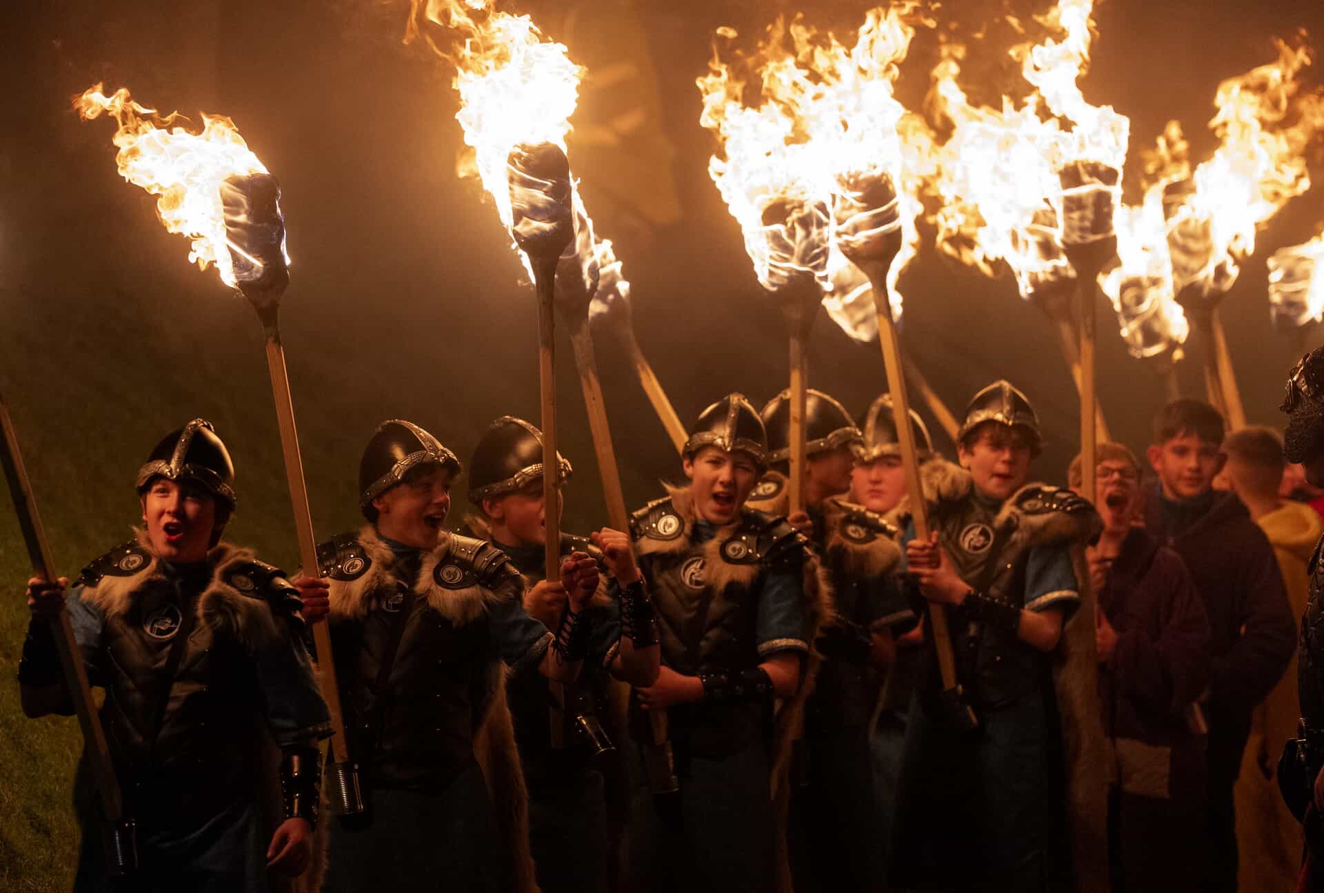 Torches are brandished in the junior parade (Jane Barlow/PA) 