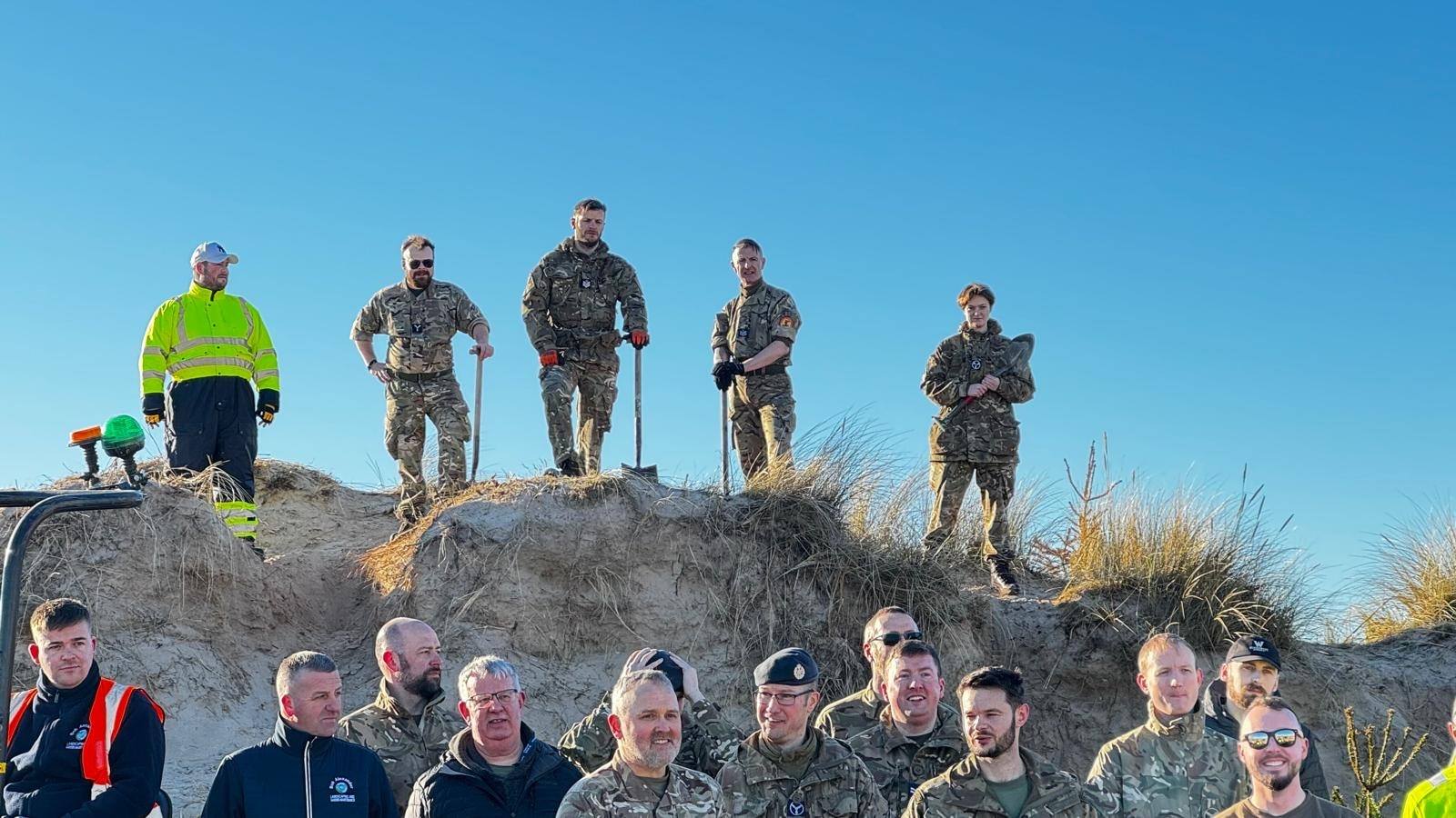 A group of Lossiemouth locals have collected recycled Christmas trees to combat coastal erosion.