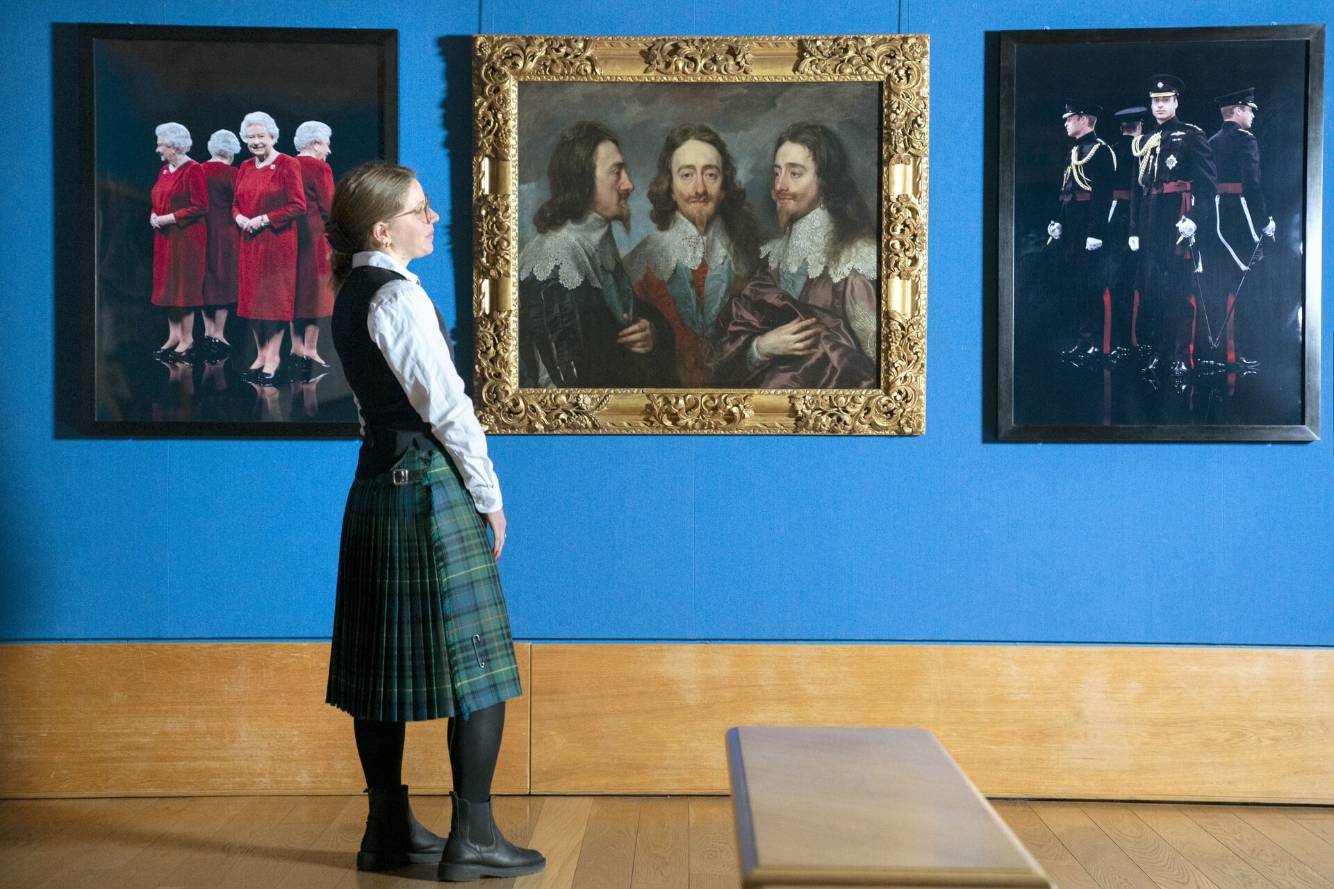 Digital chromogenic prints by Hugo Rittson-Thomas taken of Queen Elizabeth II and Prince William hang either side of Anthony van Dyck’s oil painting of Charles I 