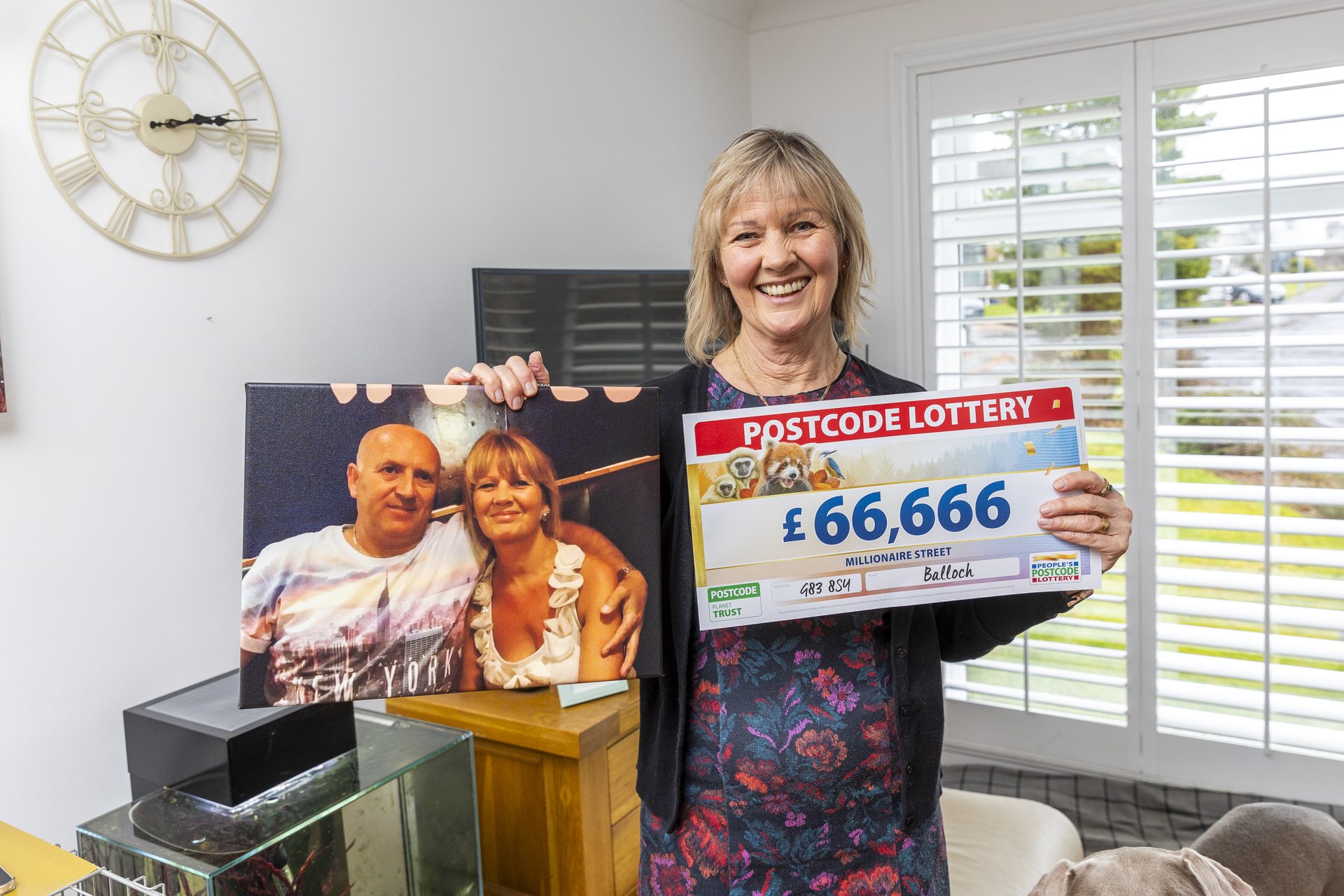 Aileen with a picture of her and her late husband, Tommy