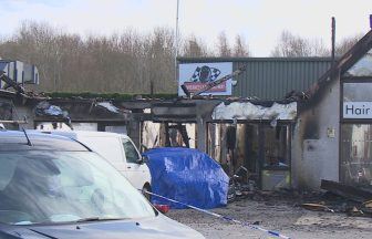 Police going door to door after car deliberately driven into Inverness business park and set on fire