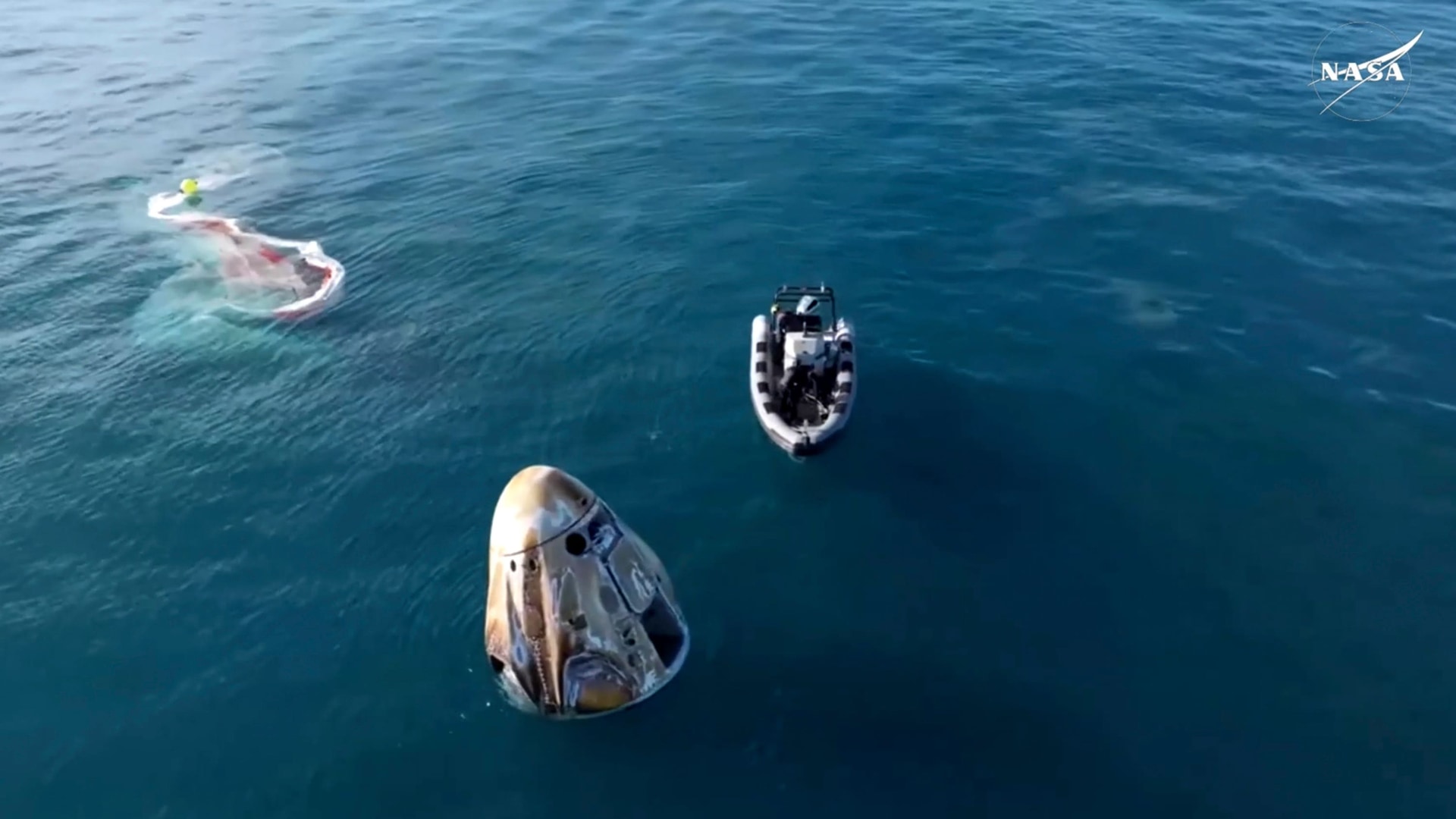 The SpaceX capsule floats in the Gulf of Mexico (Nasa/AP).