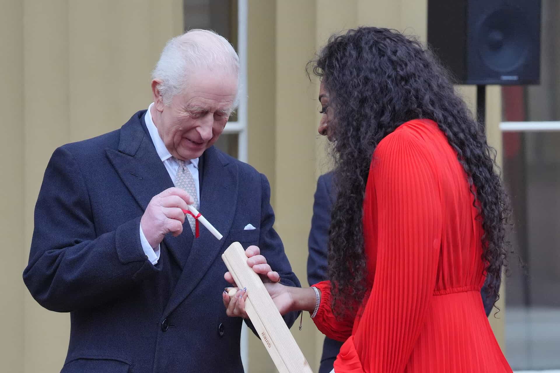 Charles placed his message into the baton with the help of Kadeena Cox.