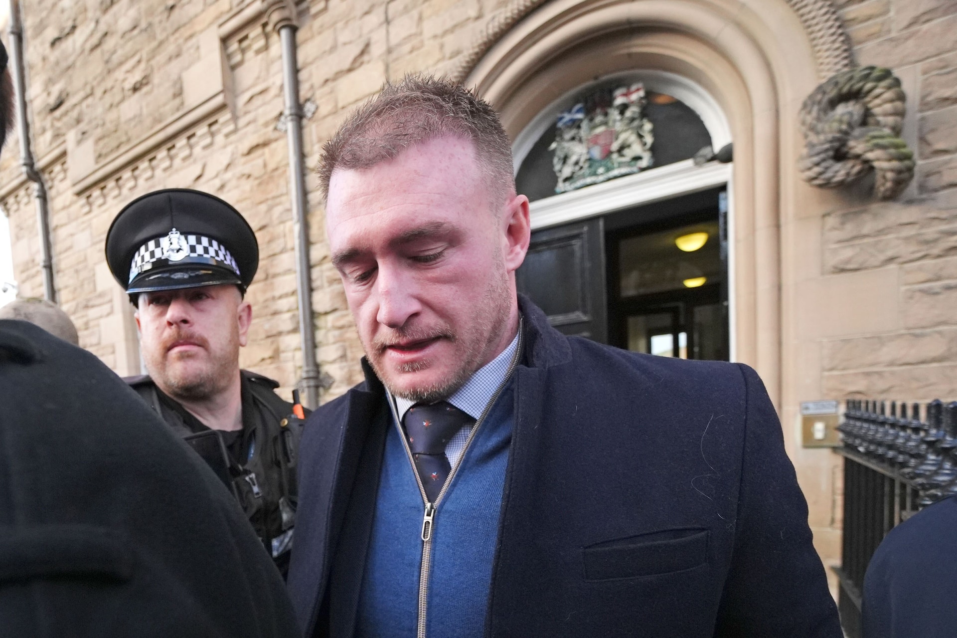 Stuart Hogg, right, pictured outside court after being sentenced on the domestic abuse charge in January (Andrew Milligan/PA) 