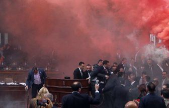 At least three Serbian MPs hurt as smoke bombs and flares thrown in parliament