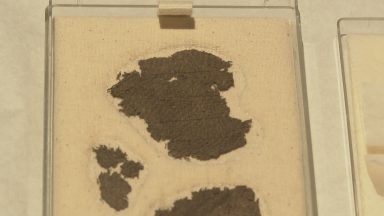 Ancient fabric discovered at bottom of loch to go on display