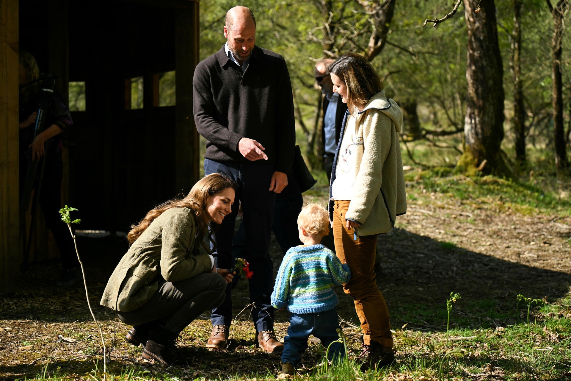 William and Kate speak to a child from the Ardura Acorns group during a visit to the Ardura Community Forest.