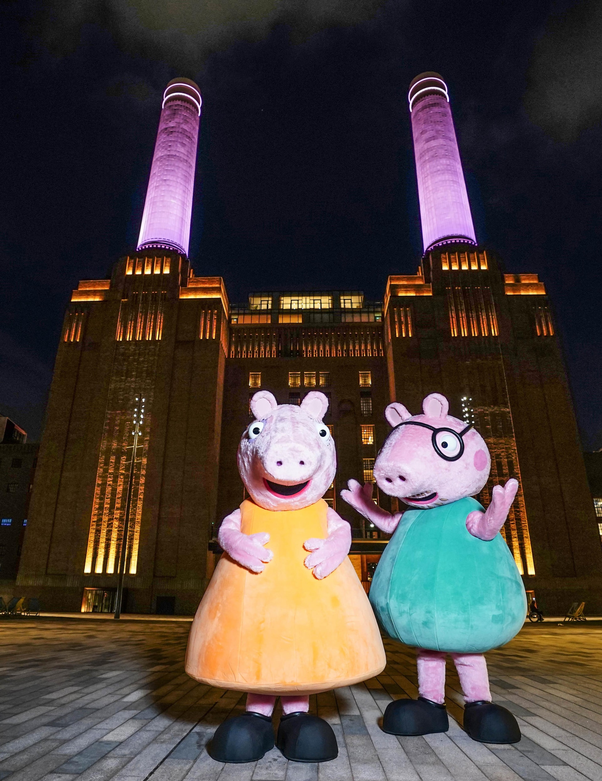 The chimneys at Battersea Power Station in London were lit up pink to announce Mummy Pig was expecting a girl (Ian West/PA).
