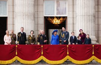Royals wave as thousands gather to watch VE Day flypast over Buckingham Palace
